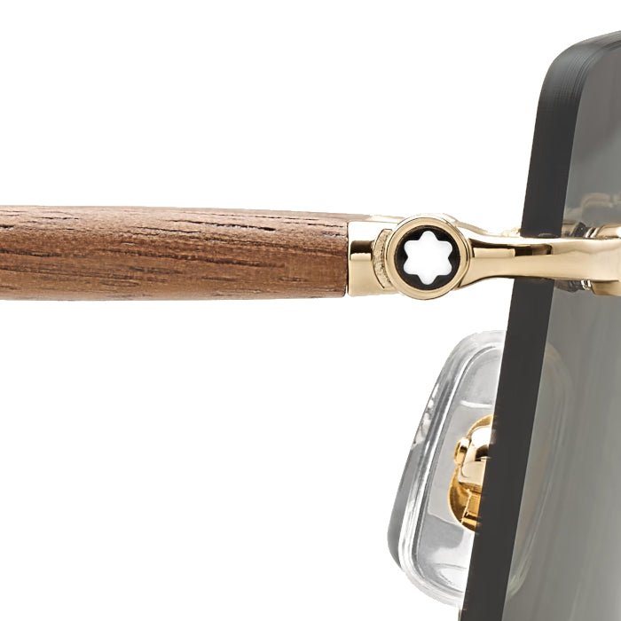 Lunettes de soleilMontblancLunettes de soleil Montblanc Rectangulaire à monture métallique dorée